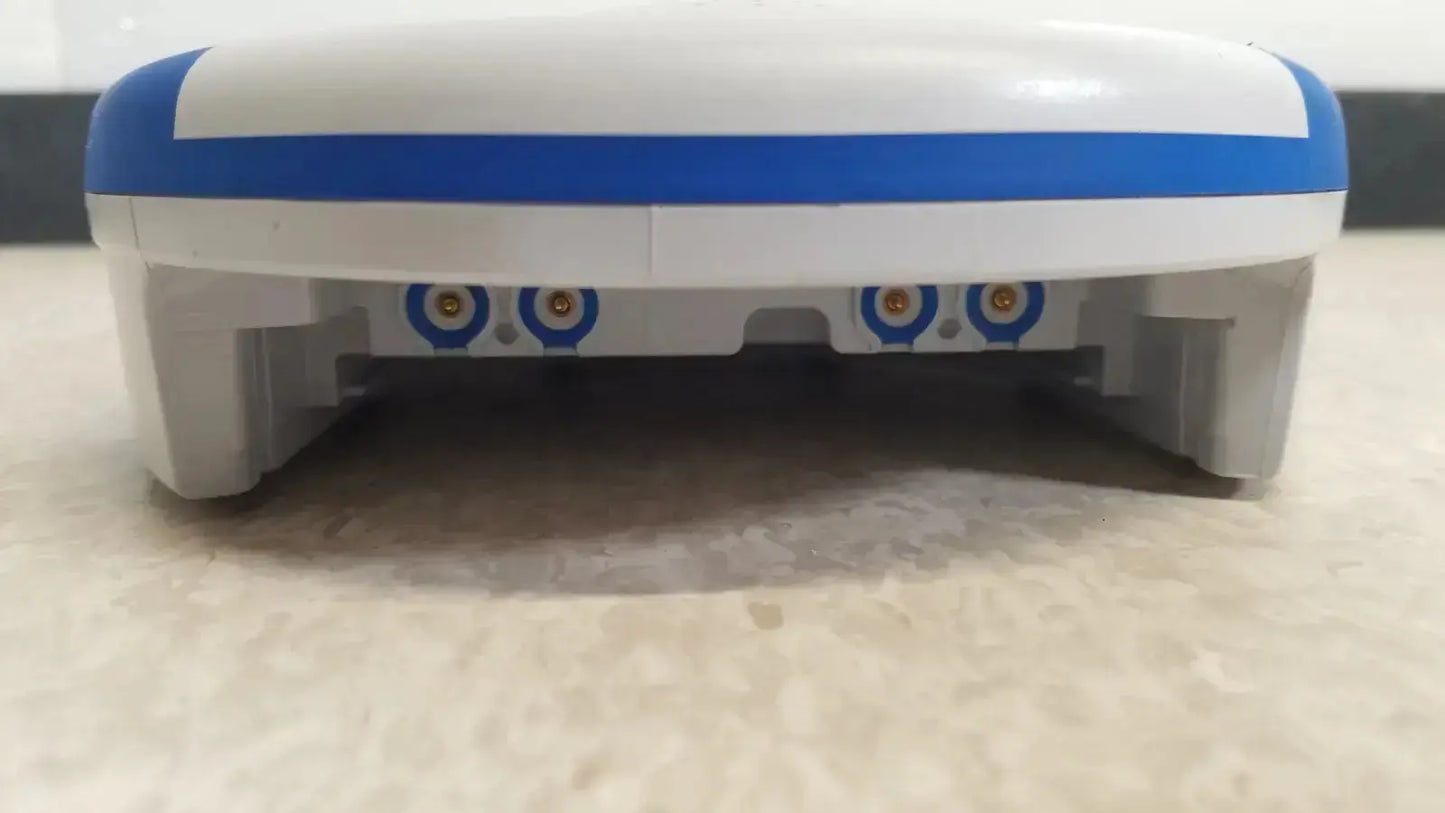 White and blue plastic robot vacuum cleaner with circular sensor lights underside shown with heartsine samaritan pad 450p