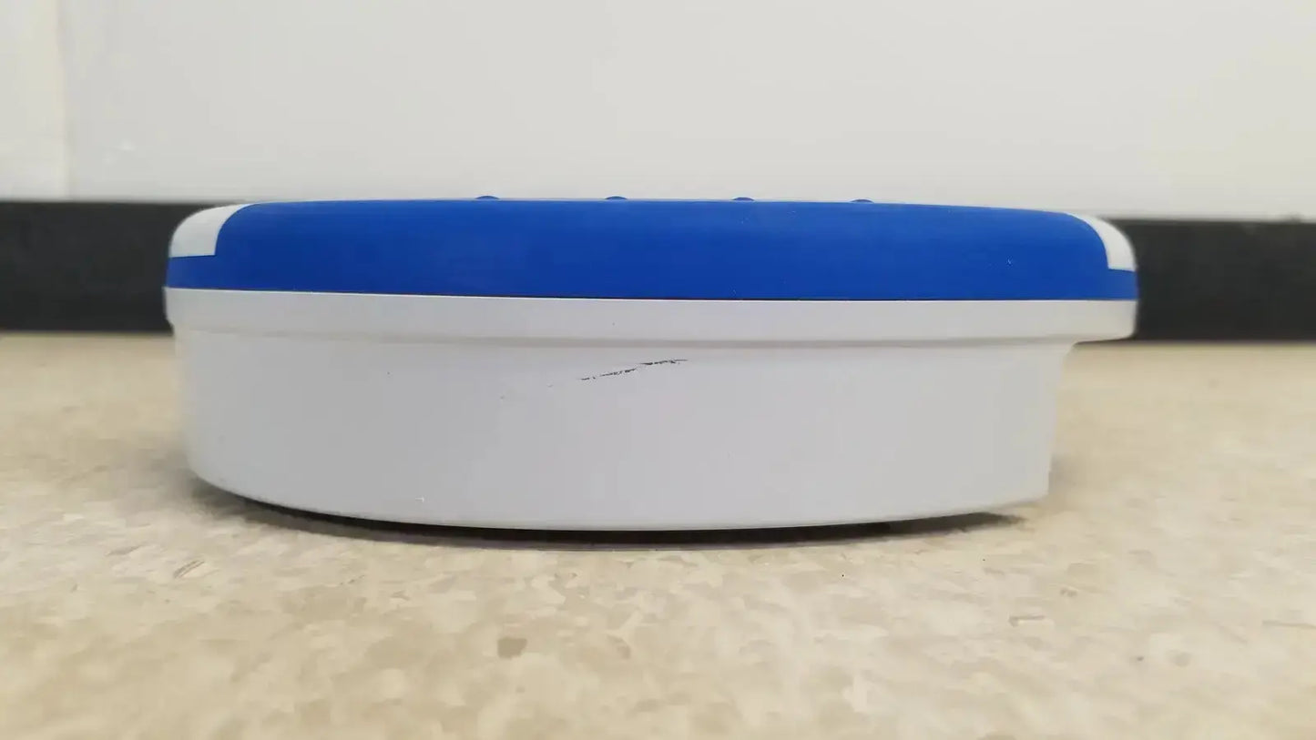 Blue and white circular device with smooth rounded design heartsine samaritan pad 450p automated external defibrillator