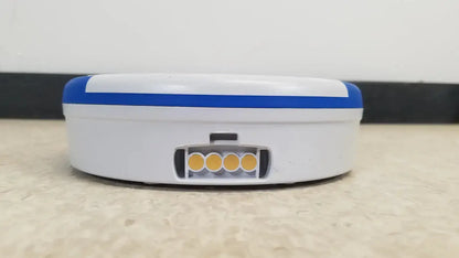 White and blue robotic vacuum cleaner with circular base and four yellow indicator lights for heartsine samaritan pad 450p