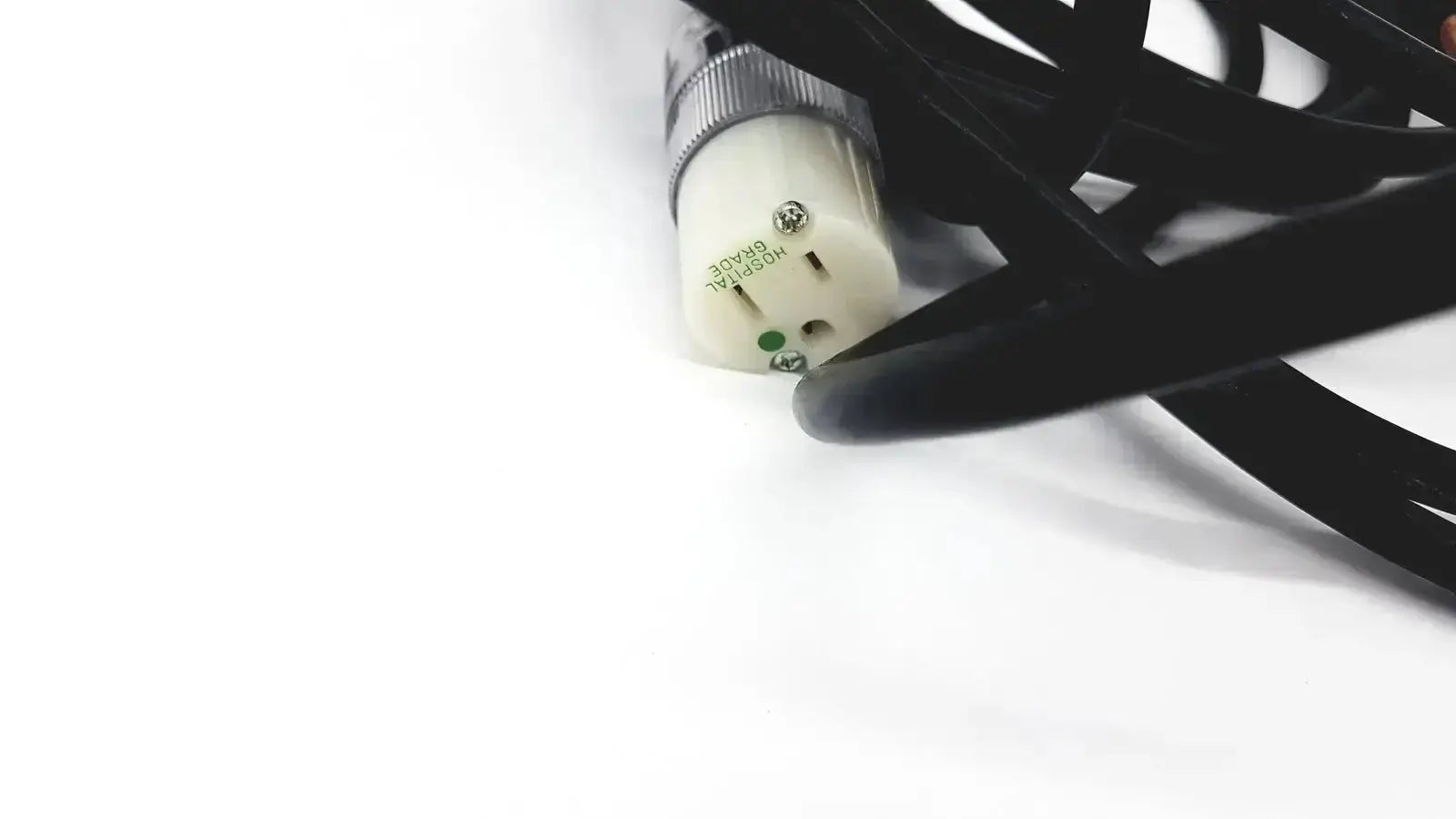 Black heavy-duty lead single phase extension cord with cream metallic-plated hospital grade plug and green grounding indicator