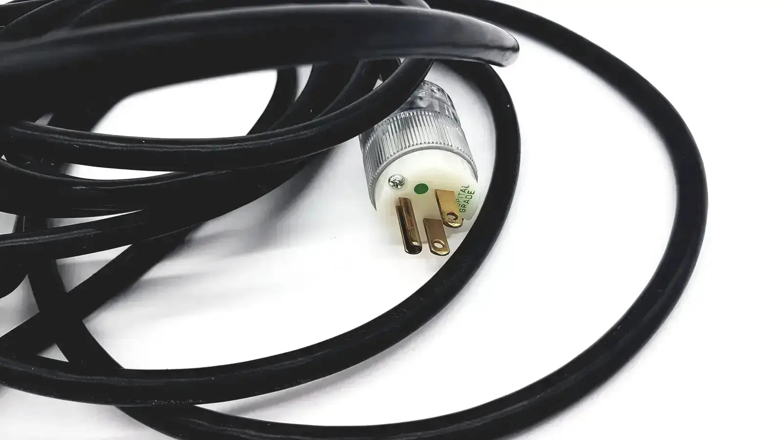 Black heavy-duty extension cord with lead single phase three-pronged plug and clear plastic housing for hospital use