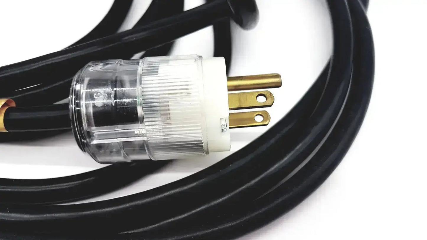 Black heavy-duty extension cord with clear plastic white insulated lead single phase plug and gold-colored prongs hospital grade
