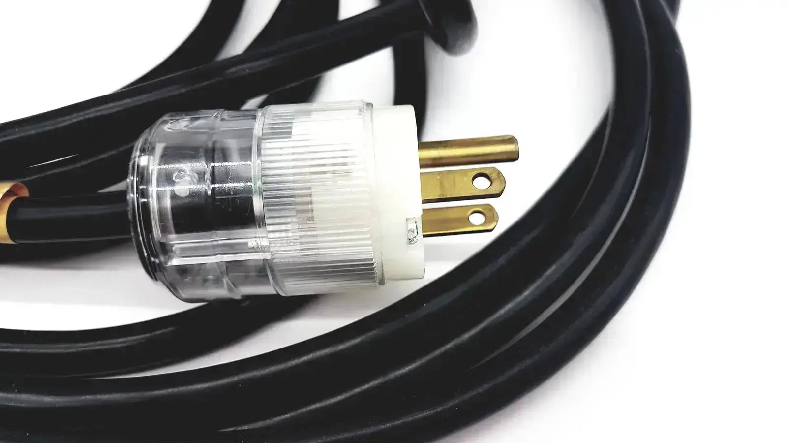 Black heavy-duty extension cord with clear plastic white insulated lead single phase plug and gold-colored prongs hospital grade