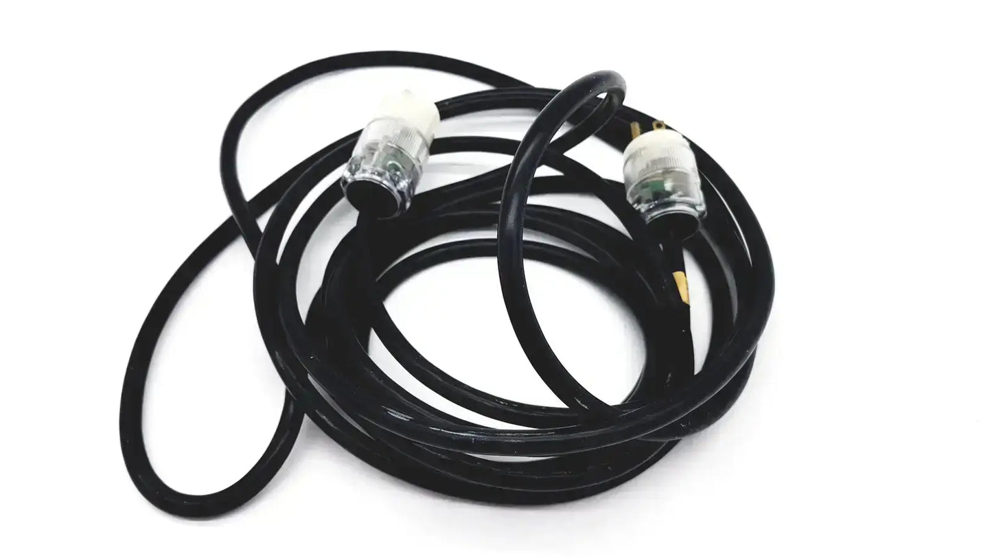 Black coiled heavy-duty extension cord with clear plastic plugs and metallic 3 pin prongs lead single phase hospital grade