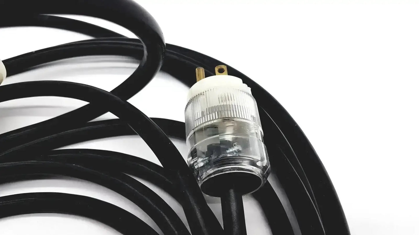 Black heavy-duty extension cord with clear ribbed plug and gold prongs lead single phase 3 pin hospital grade