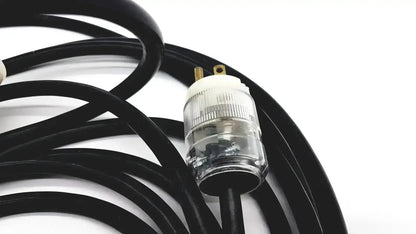 Black heavy-duty extension cord with clear ribbed plug and gold prongs lead single phase 3 pin hospital grade