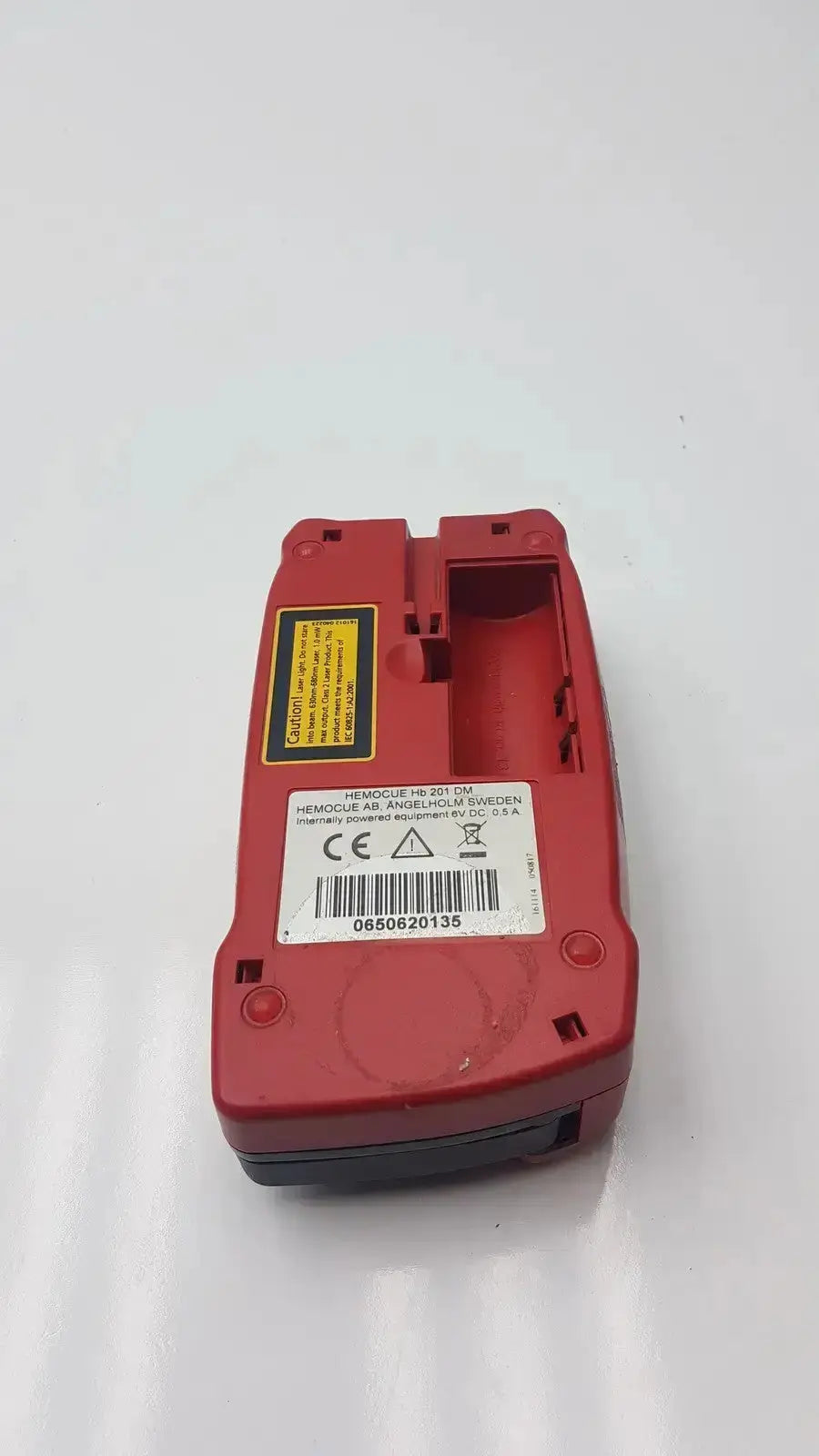 Red plastic hemocue hb 201-59 hemoglobin system analyzer with yellow warning label for biomedical evaluation reuse medical hospital surplus