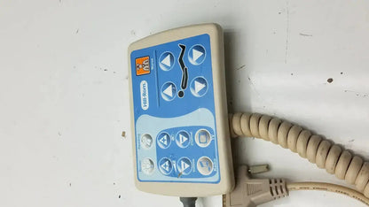Beige and blue Hill-Rom patient hand control for bed 16646202 with coiled beige cable for patient hand use