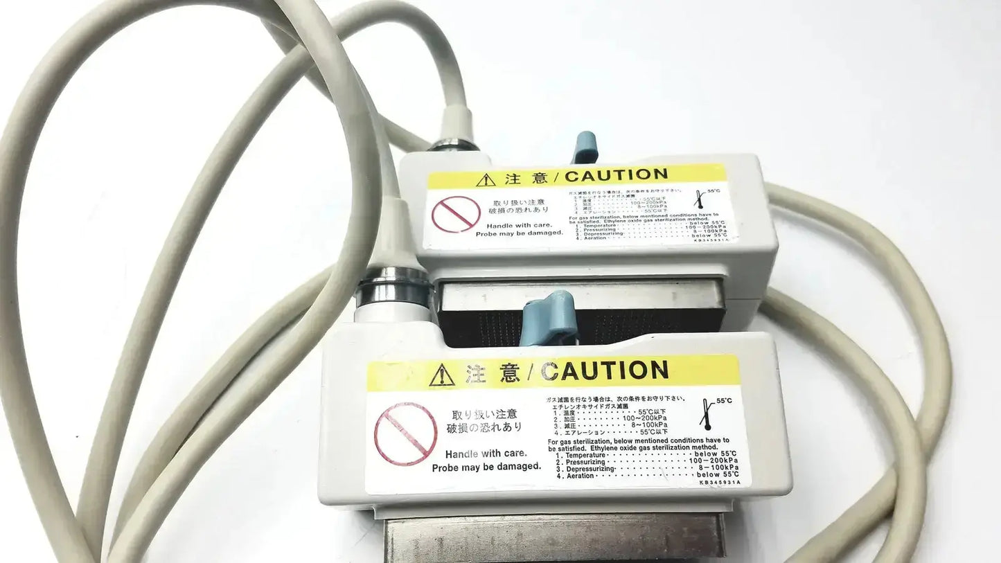 Gray medical probe connectors with caution labels and cables on the back side of hitachi eup-cc331 biplane transrectal probe