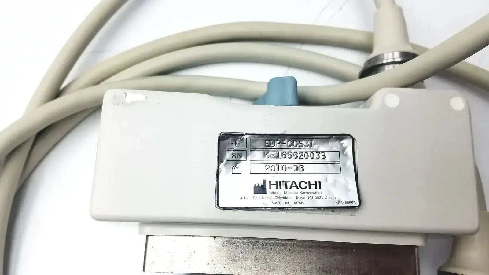 White hitachi eup-cc331 biplane transrectal ultrasound probe showing silver label with model and serial information