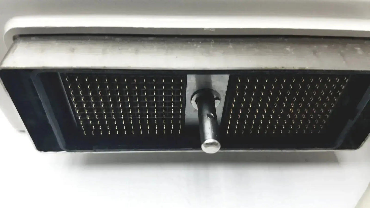 Black rectangular mesh grille with central metallic knob on white surface showing back side of hitachi eup-cc331 biplane transrectal probe