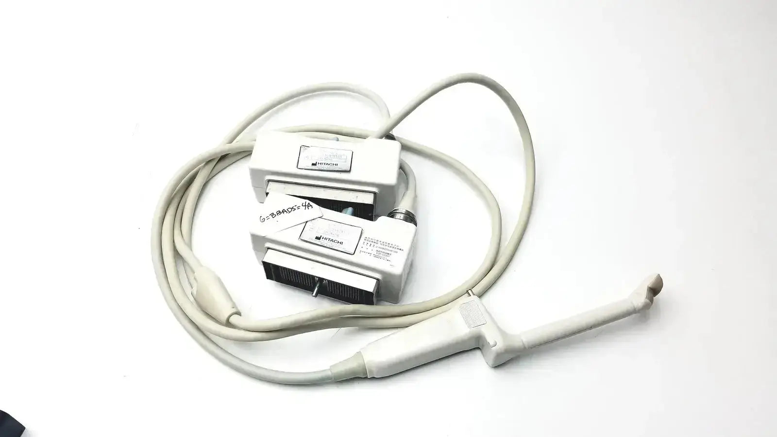 White plastic hitachi eup-cc331 biplane transrectal ultrasound transducer with attached cables and control box for medical use