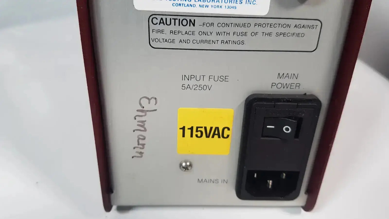 Silver and maroon hoefer ps500xt dc power supply with black toggle switch and yellow 115vac label on the back side