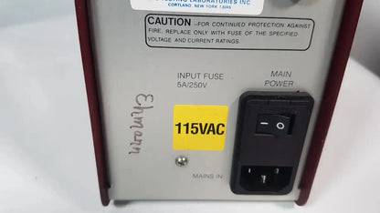 Silver and maroon hoefer ps500xt dc power supply with black toggle switch and yellow 115vac label on the back side