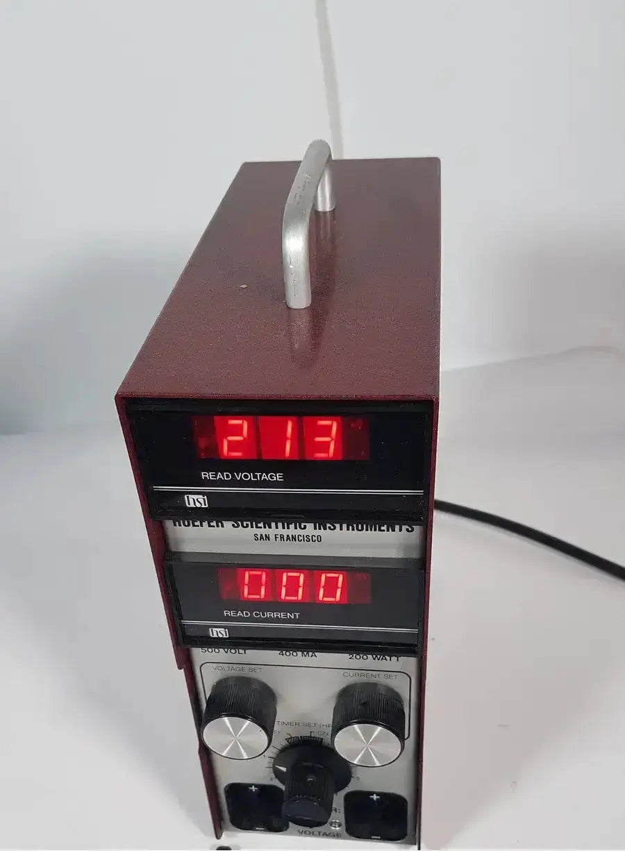 Maroon rectangular hoefer ps500xt dc power supply with silver handle and digital voltage and current readouts