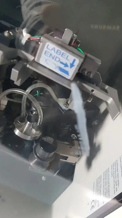Silver metallic label applicator with blue label end sticker and arrow for hologic thinprep 2000 processor biomedical evaluation reuse medical