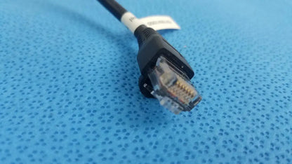 Black retractable cat5e cable with clear rj45 connector and white label for medical equipment and network use