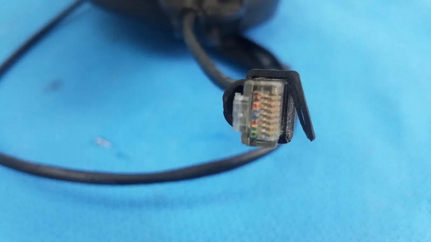 Black retractable cat5e cable with clear plastic connector housing colored wires for hospital medical equipment use
