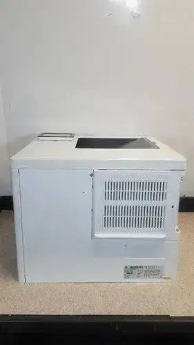 White plastic hp laserjet enterprise m555dn laser printer with vented side panel and flat top surface for office use