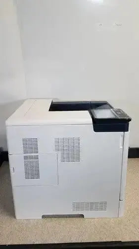 White hp laserjet enterprise m555dn color laser printer with black control panel and paper tray for efficient printing