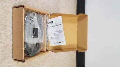 Black power splitter component in clear plastic packaging inside cardboard box for hp usb-c/a universal dock g2 with 65w power delivery and alt mode support