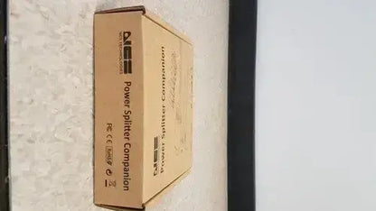 Brown cardboard box labeled power splitter companion for hp usb c a universal dock g2 station with 65w power delivery and alt mode