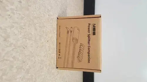 Brown cardboard box labeled power splitter companion with cable diagram for hp usb-c/a universal dock g2 station with 65w power delivery and alt mode support