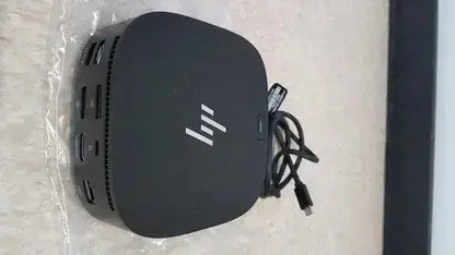 Black hp elitedesk 805 g3 mini pc backside with multiple ports and usb cable attached to hp usb-c/a universal dock g2 station with 65w power delivery single cable alt mode