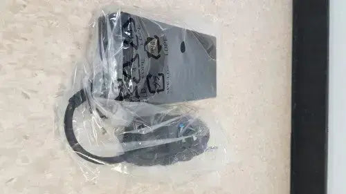 Black power adapter with coiled cable in clear plastic packaging for hp usb-c/a universal dock g2 station with 65w power delivery and alt mode