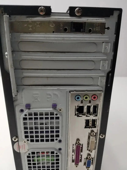 Rear panel of gray metal hughes network model mgs3550 desktop computer tower with multiple ports from hospital surplus