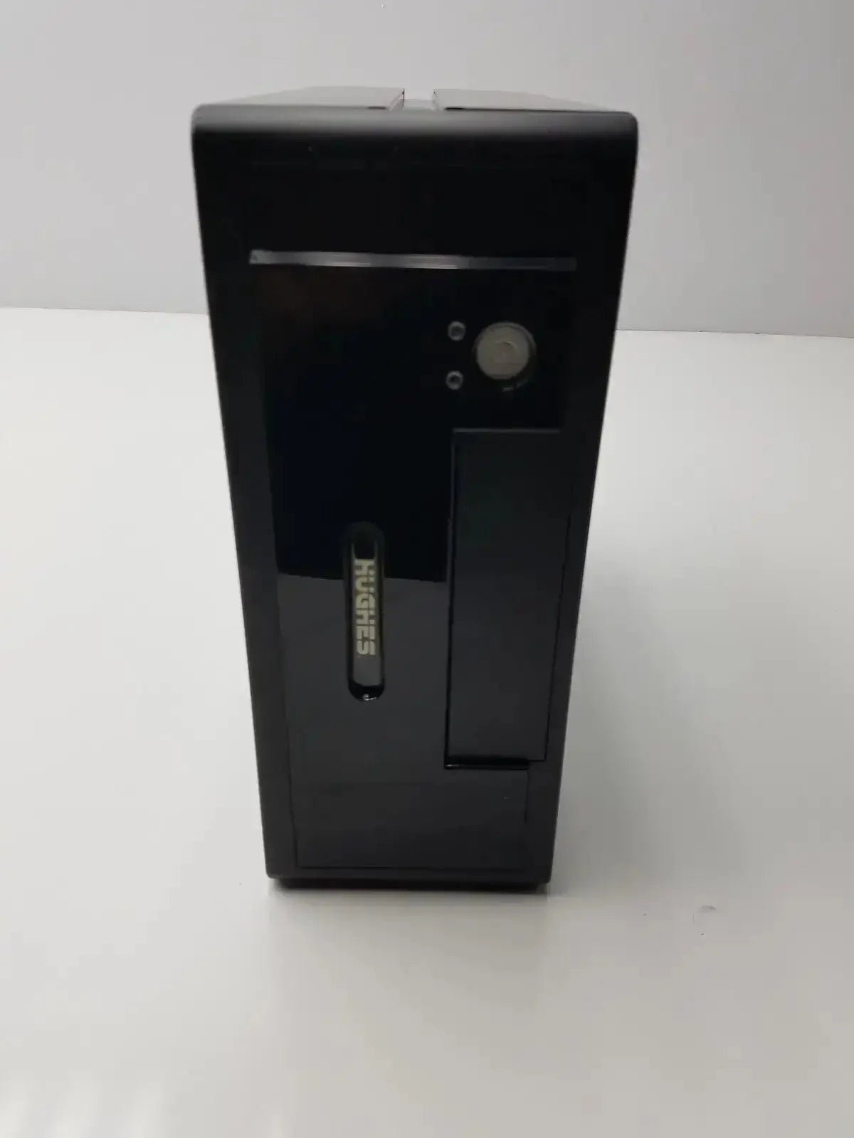 Black Hughes Network desktop tower model MGS3550 with glossy finish and vertical branding from hospital surplus