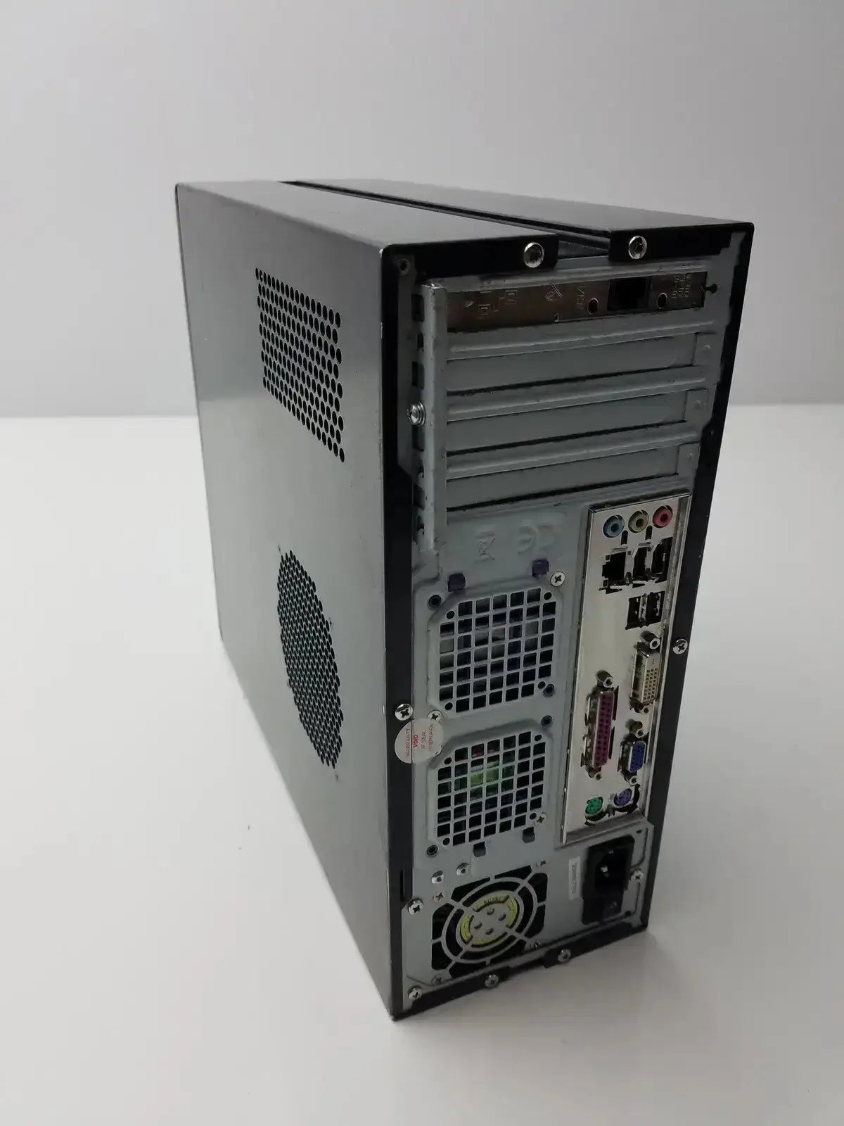 Gray metal desktop computer tower with perforated side panel and rear i o ports hughes network model mgs3550 hospital surplus