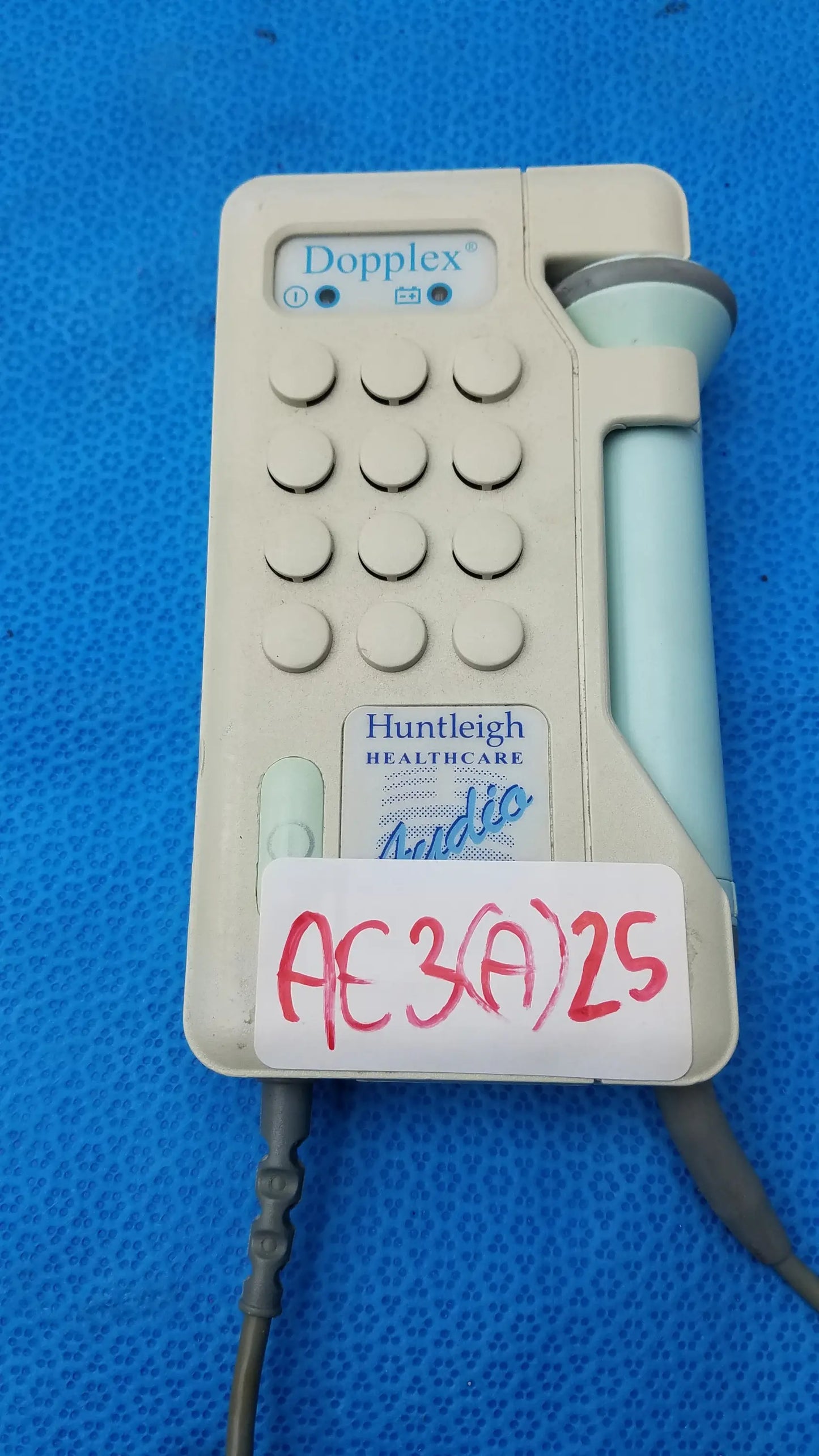 Beige and light blue huntleigh dopplex d920 handheld doppler ultrasound machine with keypad, medical equipment use