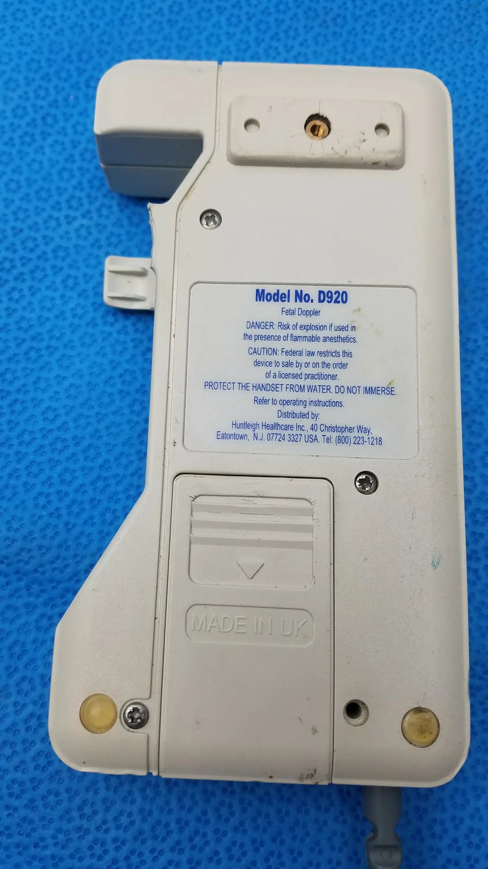 White plastic Huntleigh Dopplex D920 handheld fetal doppler with made in UK label for medical equipment use