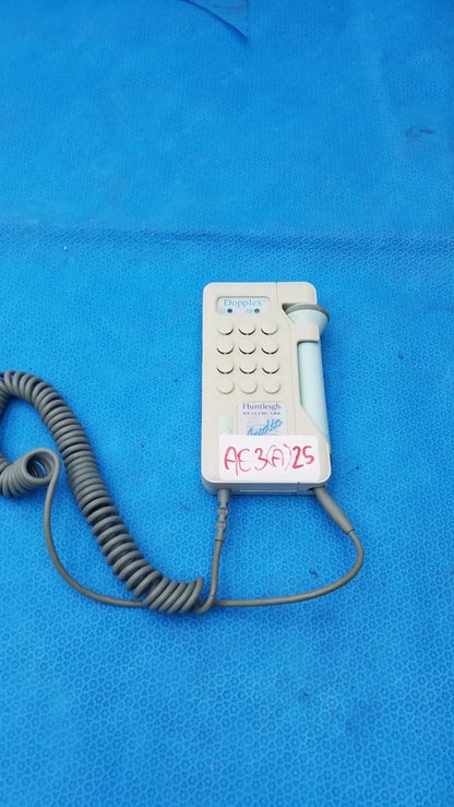 White handheld Huntleigh Dopplex D920 medical equipment with coiled gray cord and light blue probe by Smiths Medical
