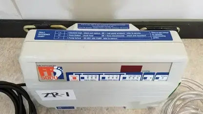 White plastic huntleigh vp5000 dvt foot spa machine with blue and red control panel labeled freedom 5000 vp5000 dvt pump