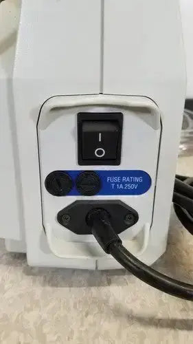 White plastic power supply unit with black switch and blue fuse label for huntleigh vp5000 dvt pump