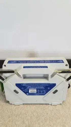 White plastic battery pack with blue labeling and black cables for huntleigh vp5000 dvt pump device