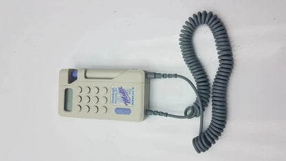 Beige handheld Huntleigh dopplex ii md2 fetal monitor with coiled gray cable and purple button for used medical equipment for sale
