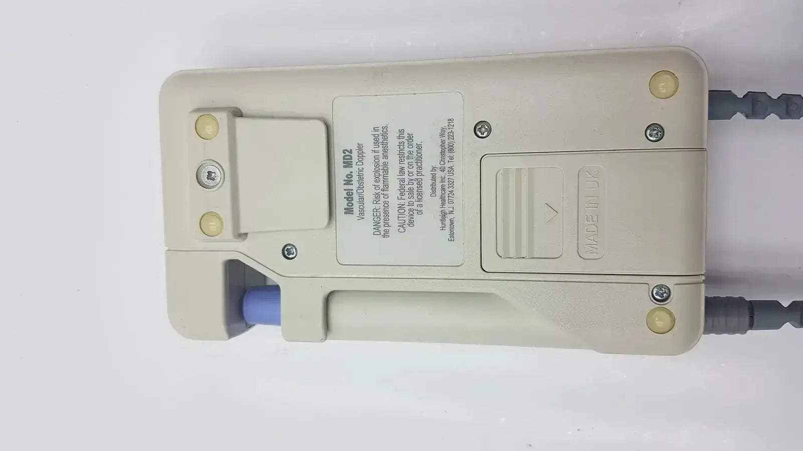 Beige plastic handheld dopplex ii md2 dosimeter with gray cables and blue connector for huntleigh dopplex used medical equipment for sale