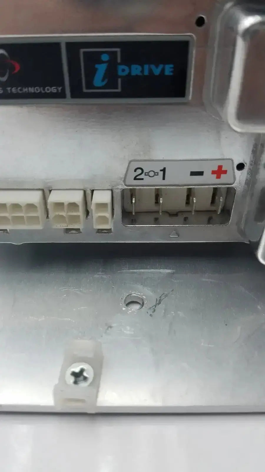Silver metallic idrive motor controller d51501.01 with white plastic connectors and labeled terminal block by pg drive technology