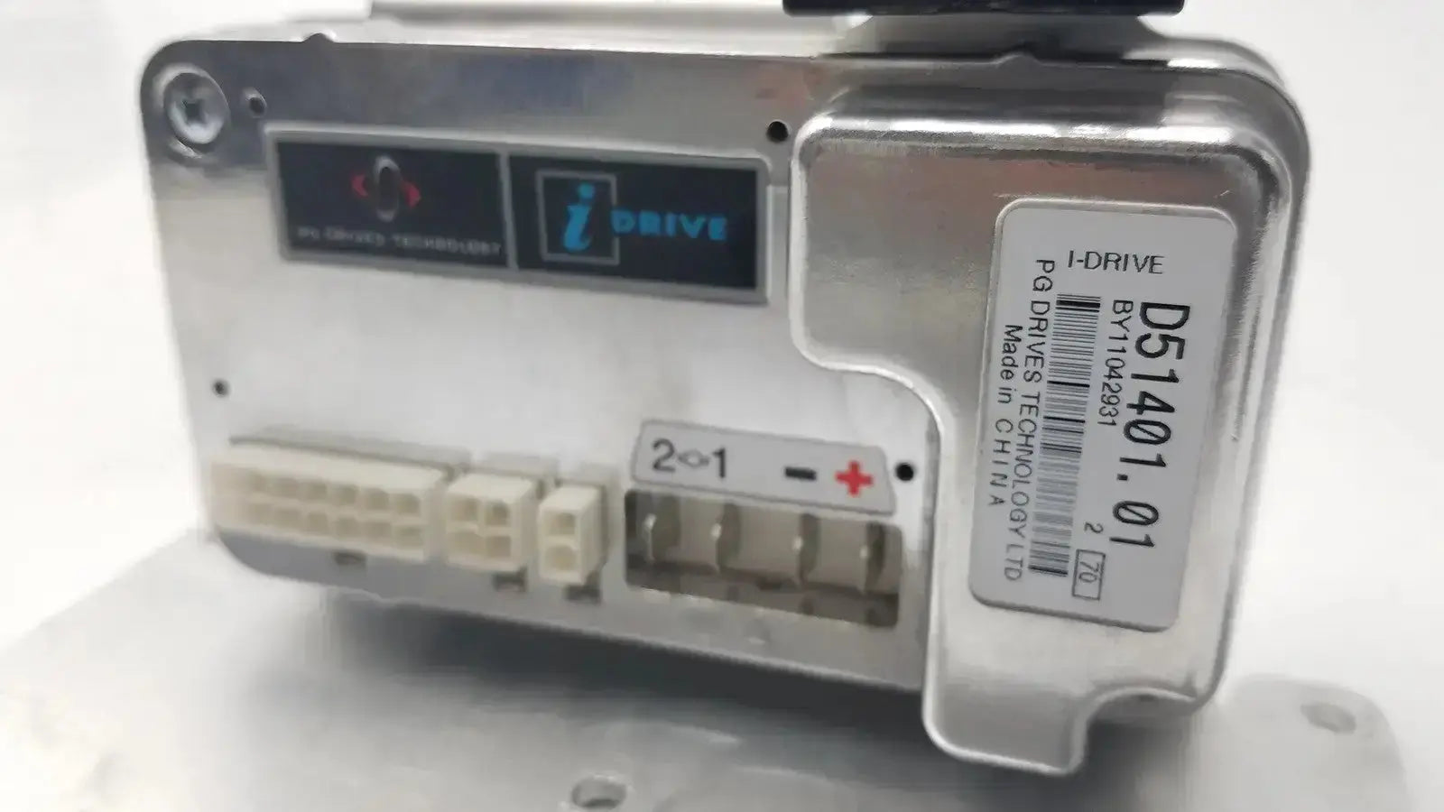 Silver metallic idrive motor controller d51501.01 with white connectors by pg drive technology ltd made in china model ds1401.01
