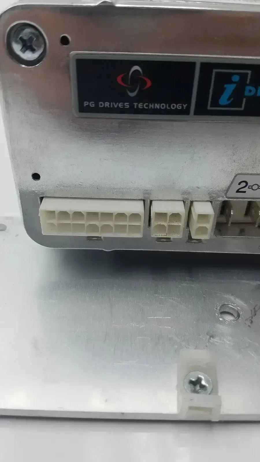 Silver metallic iDrive motor controller with white connectors and black pg drives technology label for drive technology applications