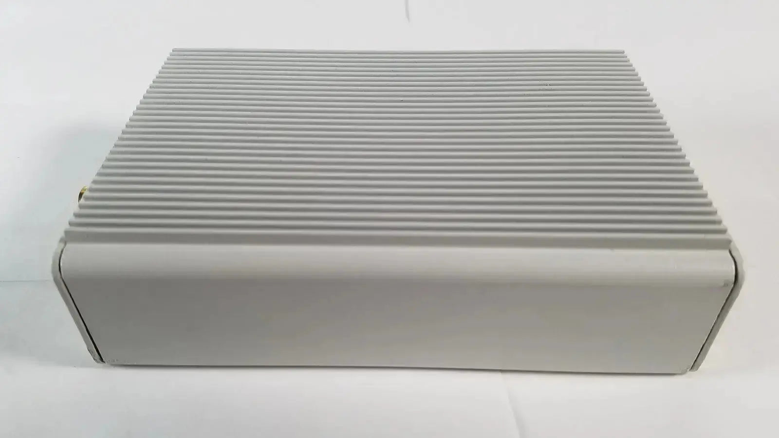 Gray rectangular electronic device with ribbed top surface and smooth sides image stream medical easylink adapter el012277