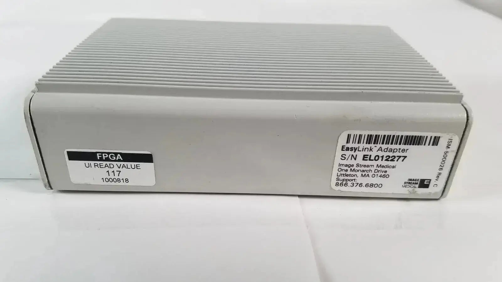 Gray rectangular image stream medical easylink adapter EL012277 with ribbed top and labeled model and serial stickers