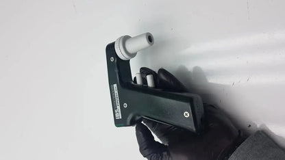 Black integra biosciences acu pipetboy controller handheld device with white cylindrical biological sample handler attachments