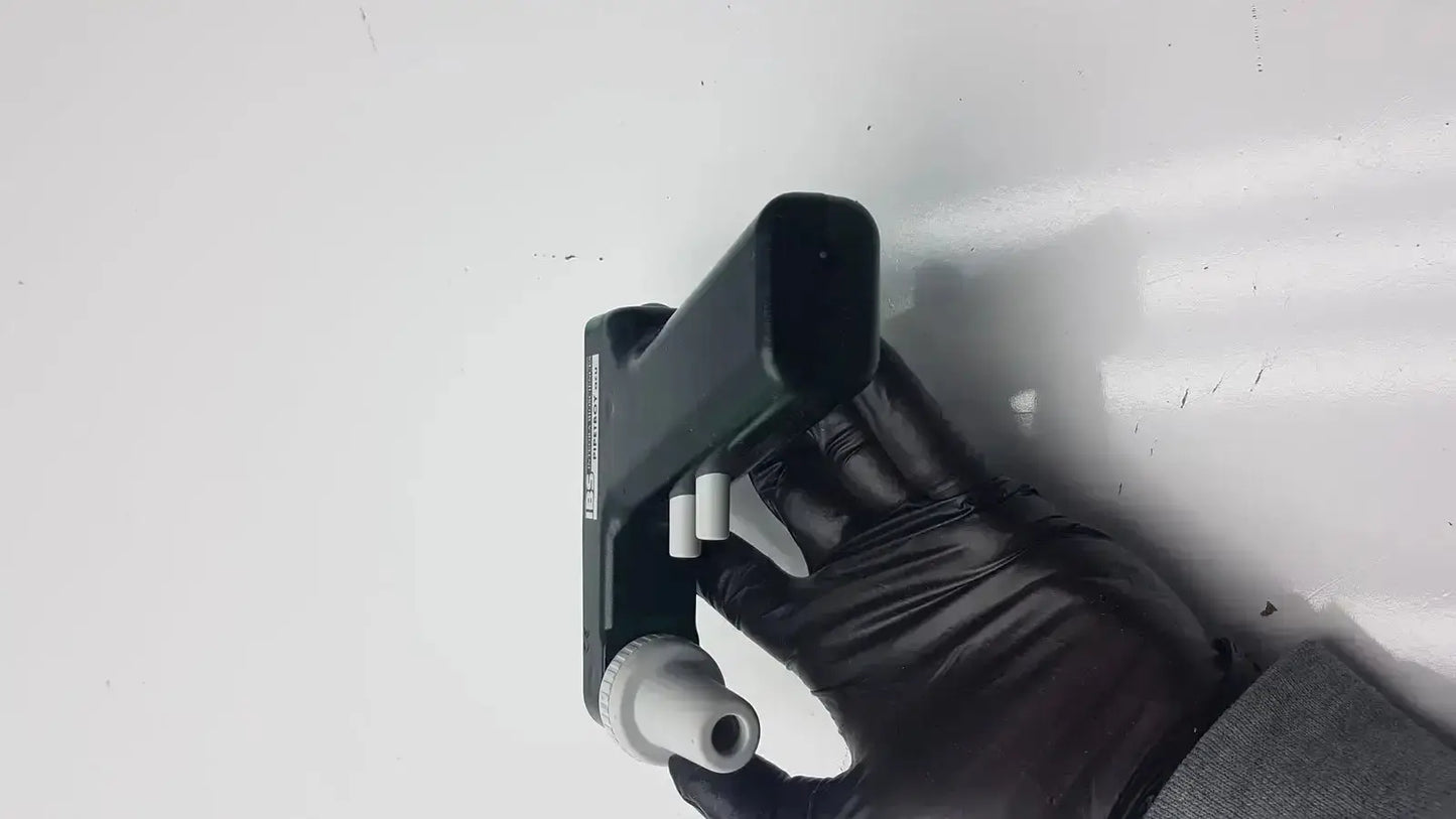 Black plastic pipette with white tips and textured grip from integra biosciences acu pipetboy controller
