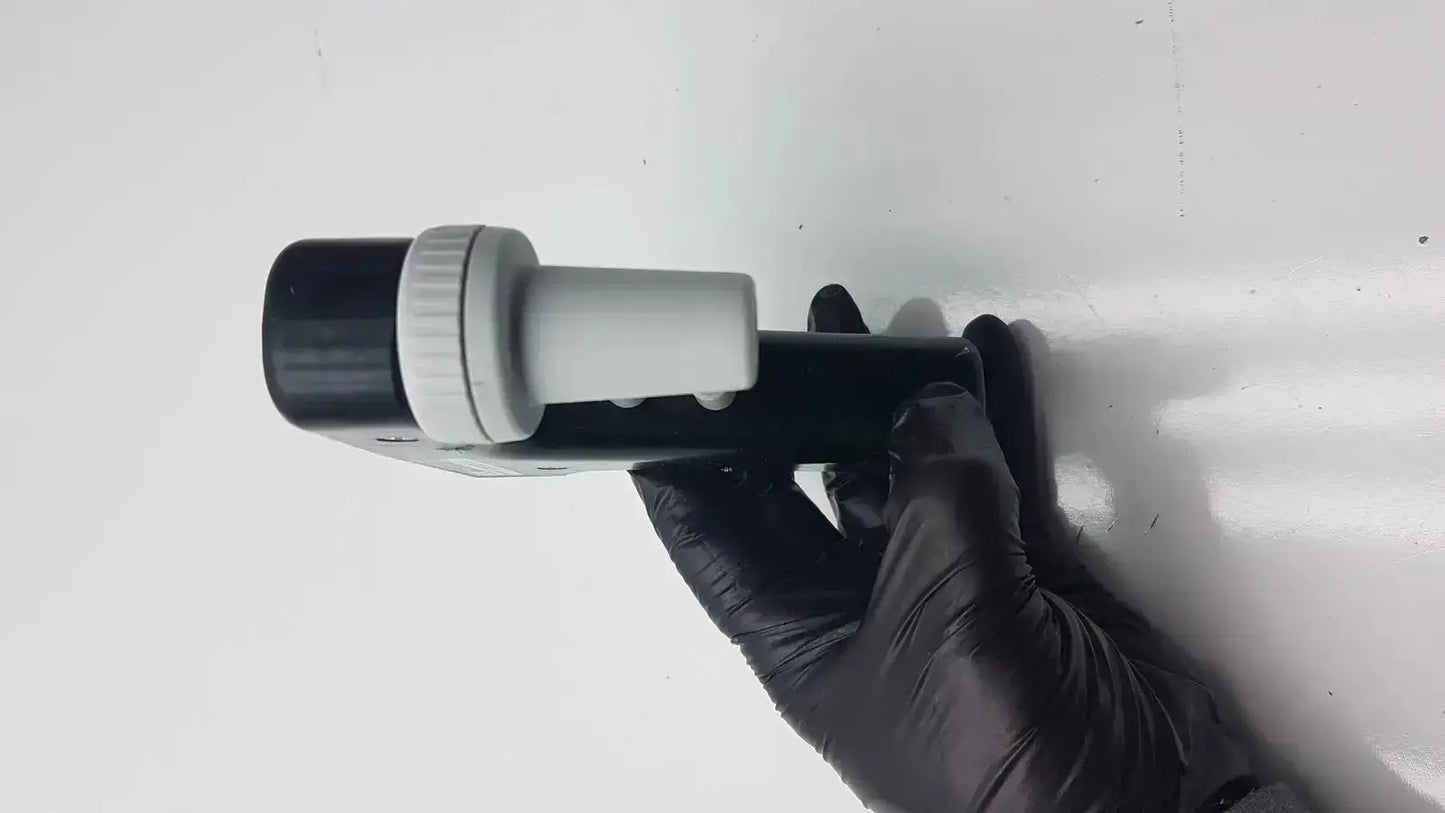 Black and white integra biosciences acu pipetboy controller with textured grip and cylindrical lens assembly on top