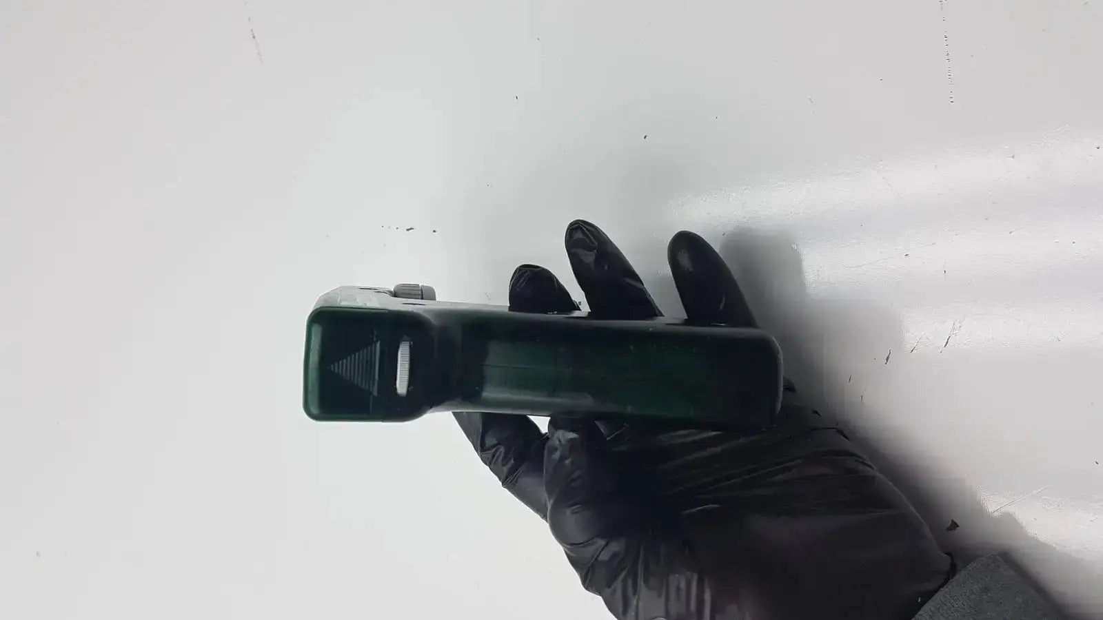 Dark green integra biosciences acu biosciences acu pipetboy controller handheld device with textured grip and rectangular shape