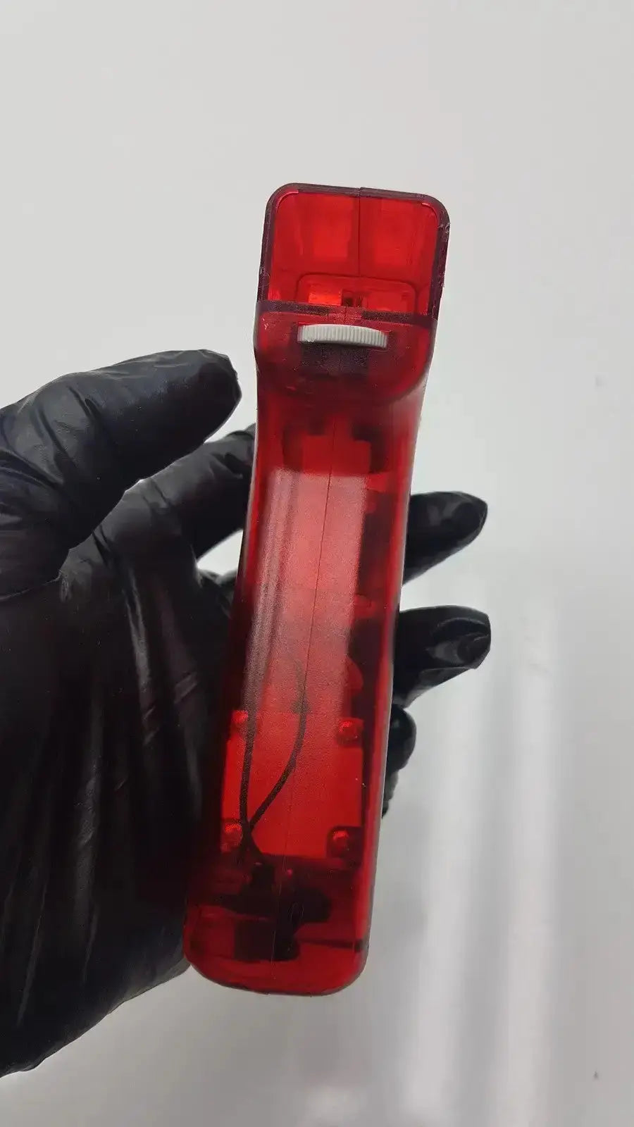 Integra biosciences acu pipetboy controller red translucent plastic remote with internal wiring and a white top button